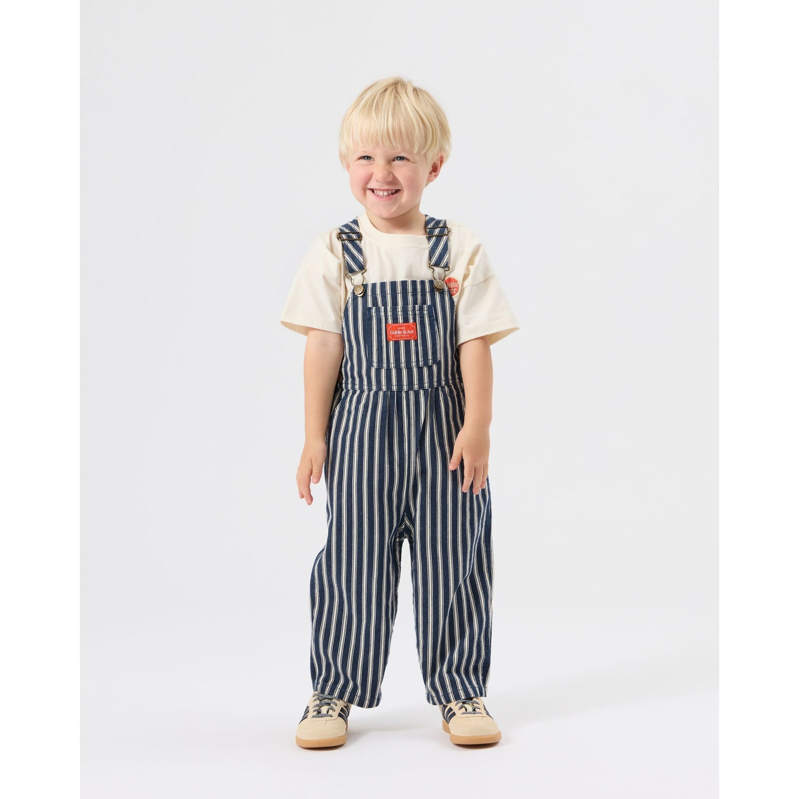 Child wearing Goldie & Ace Railroad Stripe Austin Overalls