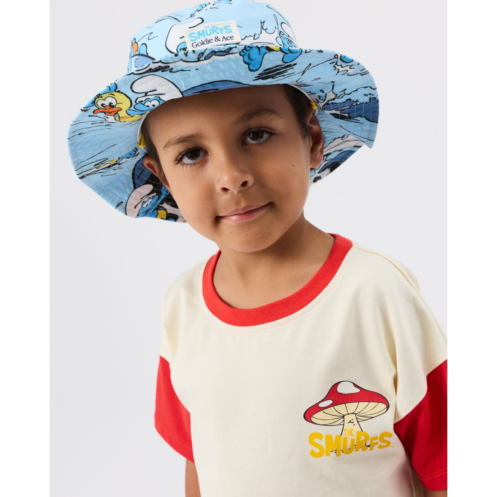 Child wearing Goldie & Ace x The Smurfs Splash Swim Hat