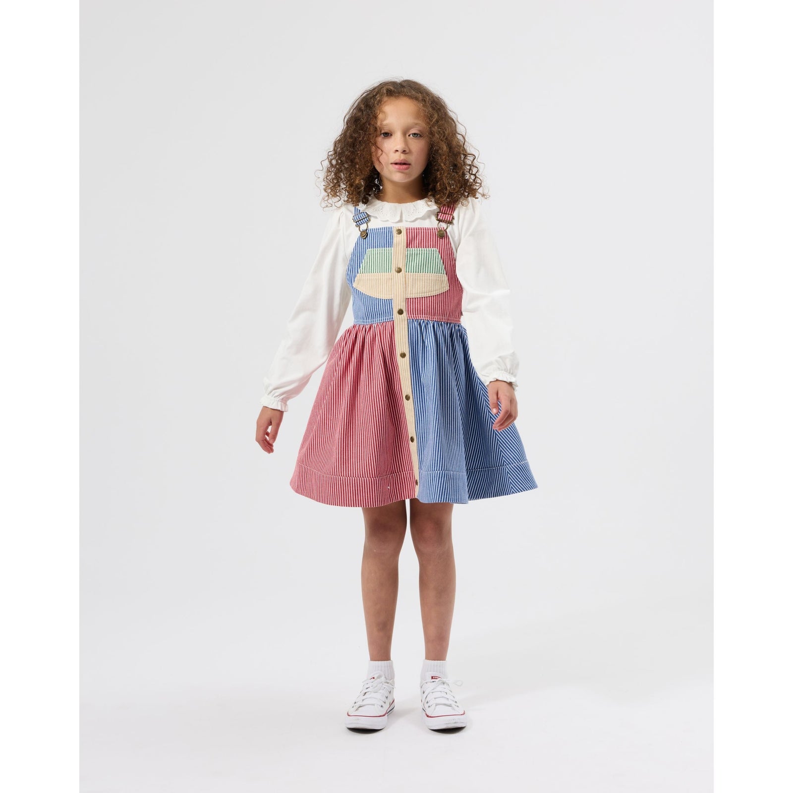 Child wearing Goldie & Ace Patchwork Stripe Heidi Pinafore Dress, view 2