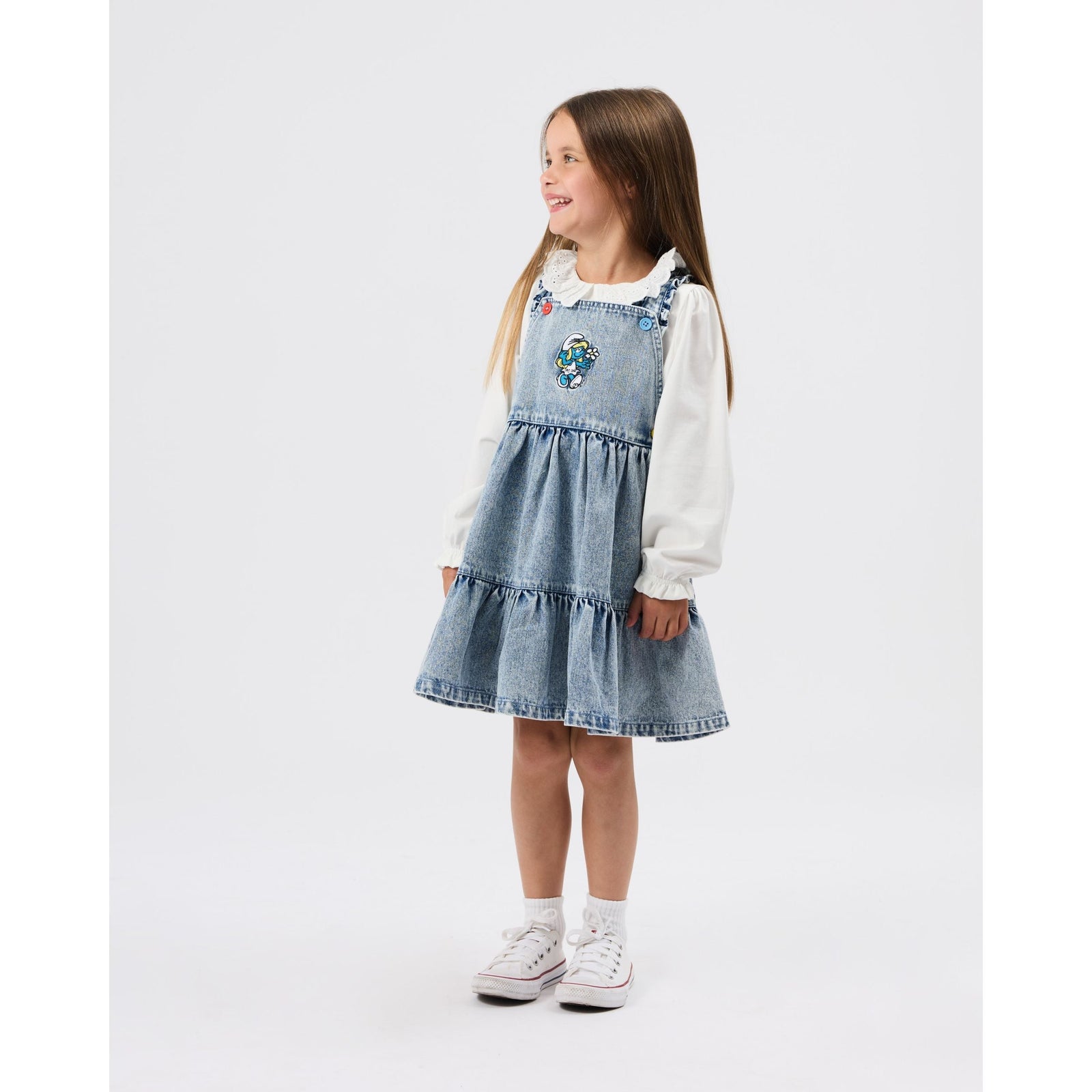 Child wearing Goldie & Ace x The Smurfs Smurfette Pinafore Denim Dress, view 3
