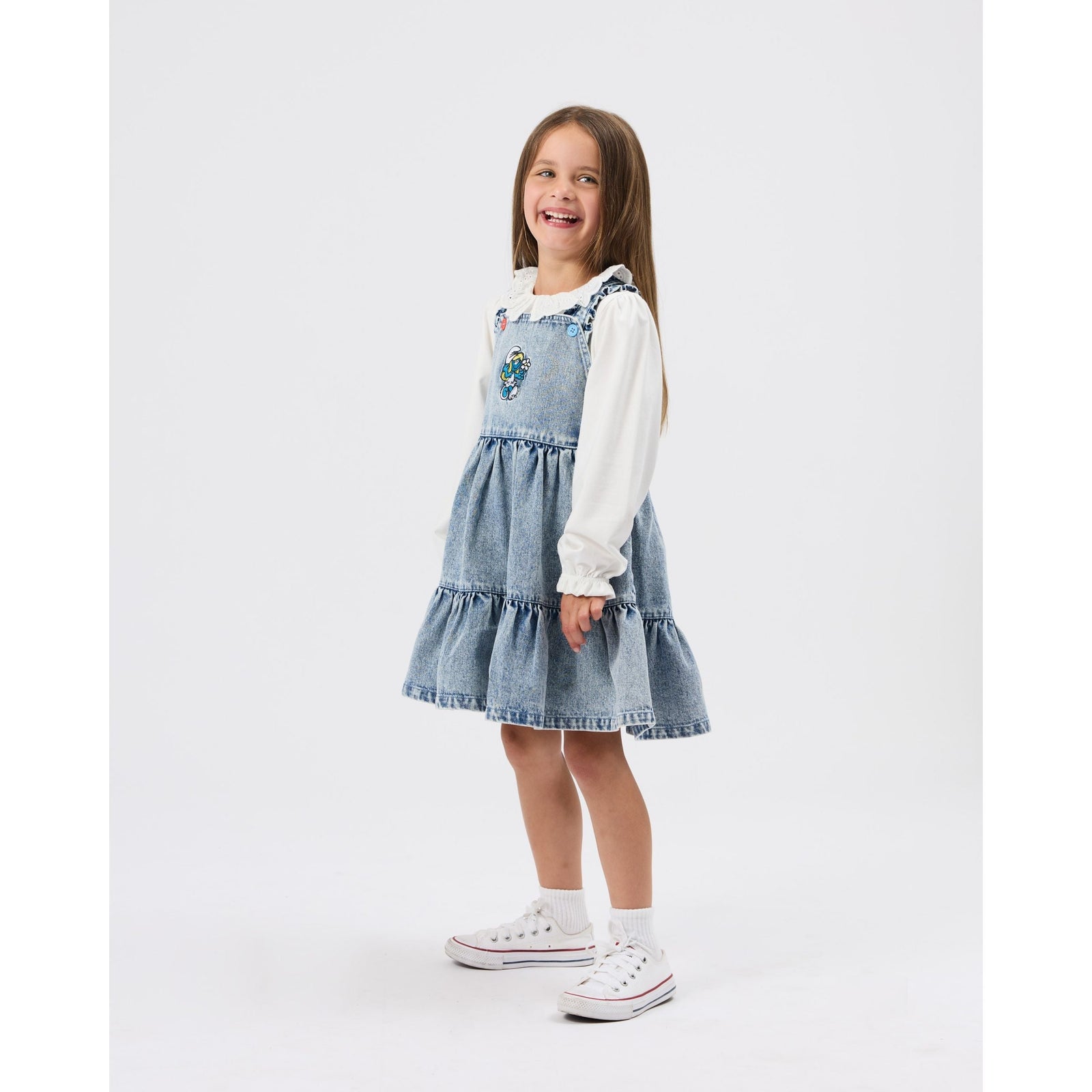 Child wearing Goldie & Ace x The Smurfs Smurfette Pinafore Denim Dress, view 2