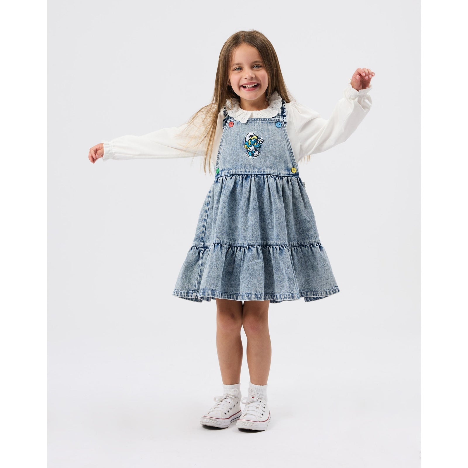 Child wearing Goldie & Ace x The Smurfs Smurfette Pinafore Denim Dress, view 4