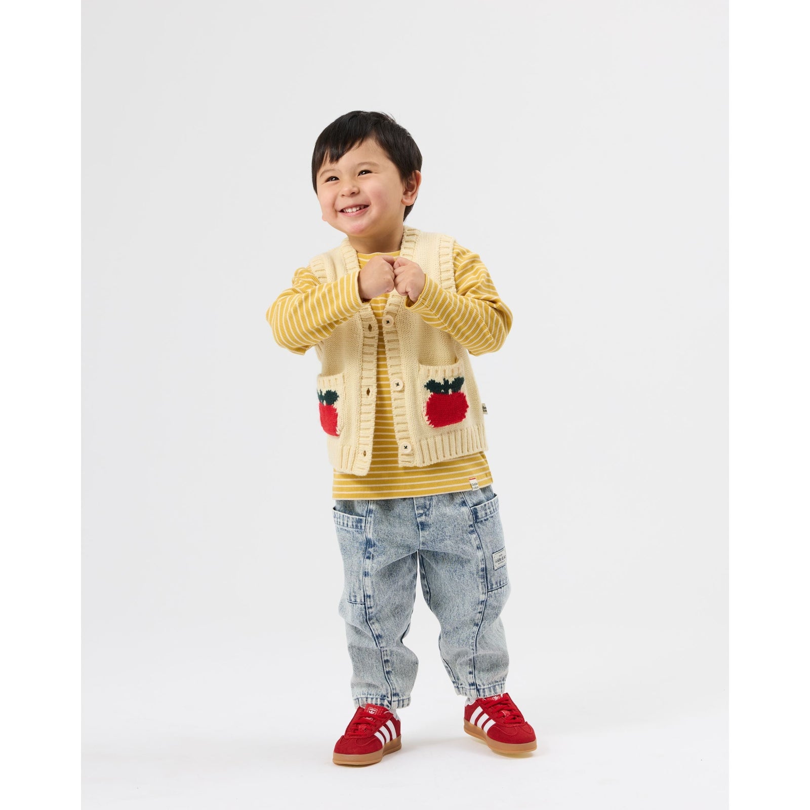 Child wearing Goldie & Ace Apple Pocket Knit Vest