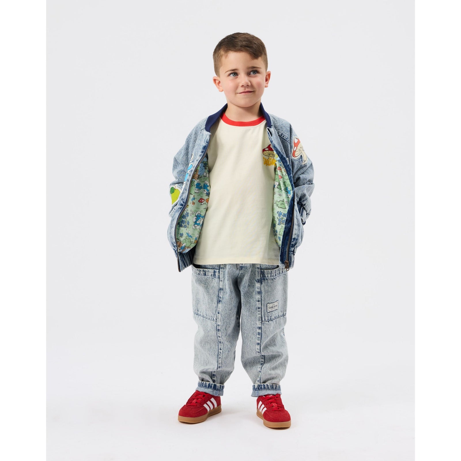 Child wearing Goldie & Ace x The Smurfs Badge Bomber Jacket, view 2