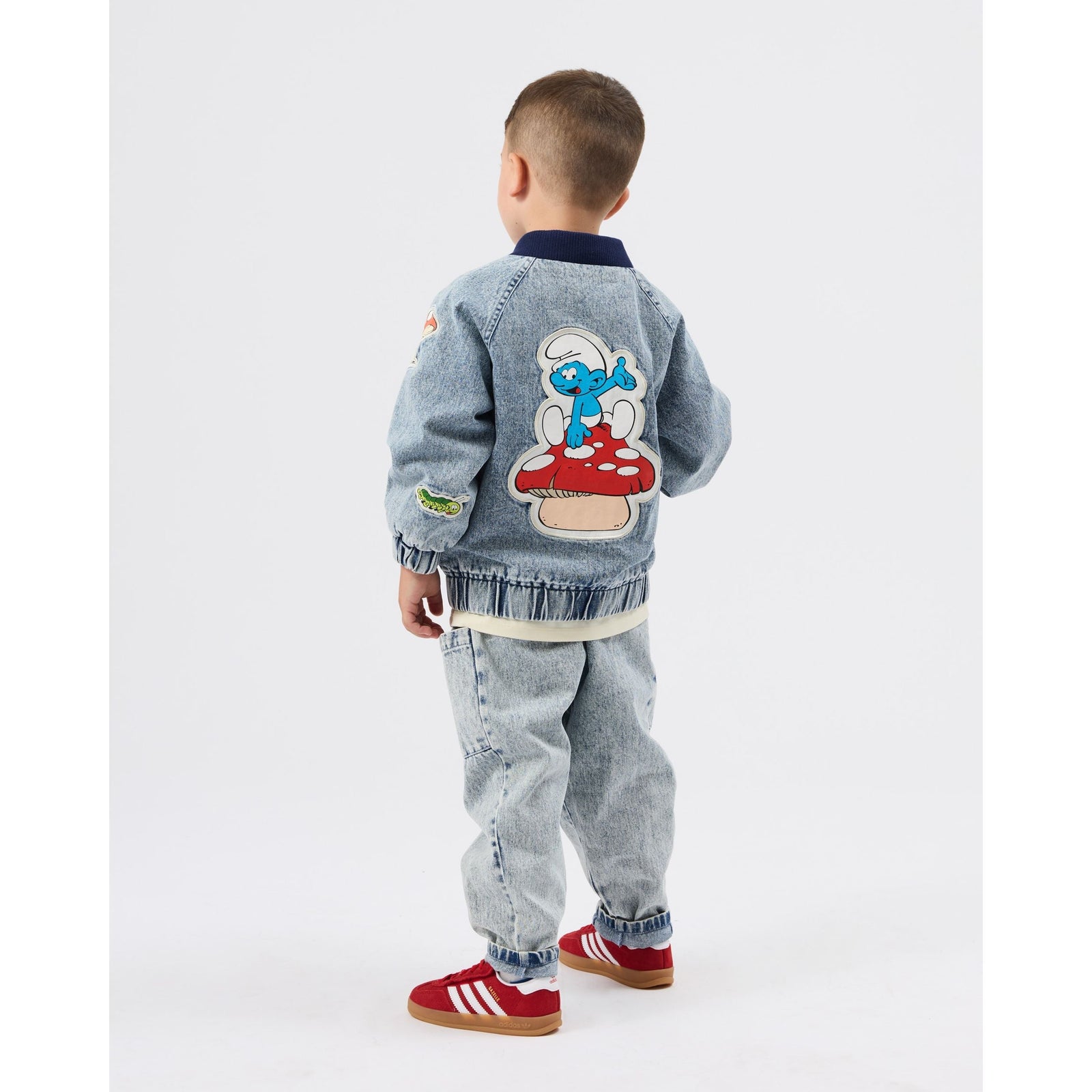 Child wearing Goldie & Ace x The Smurfs Badge Bomber Jacket