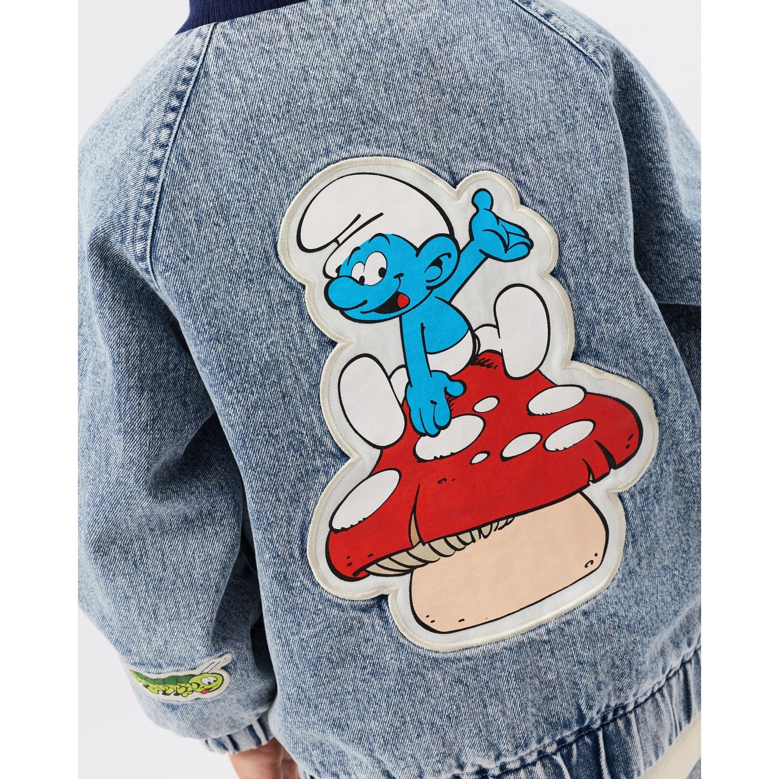 Child wearing Goldie & Ace x The Smurfs Badge Bomber Jacket, view 5