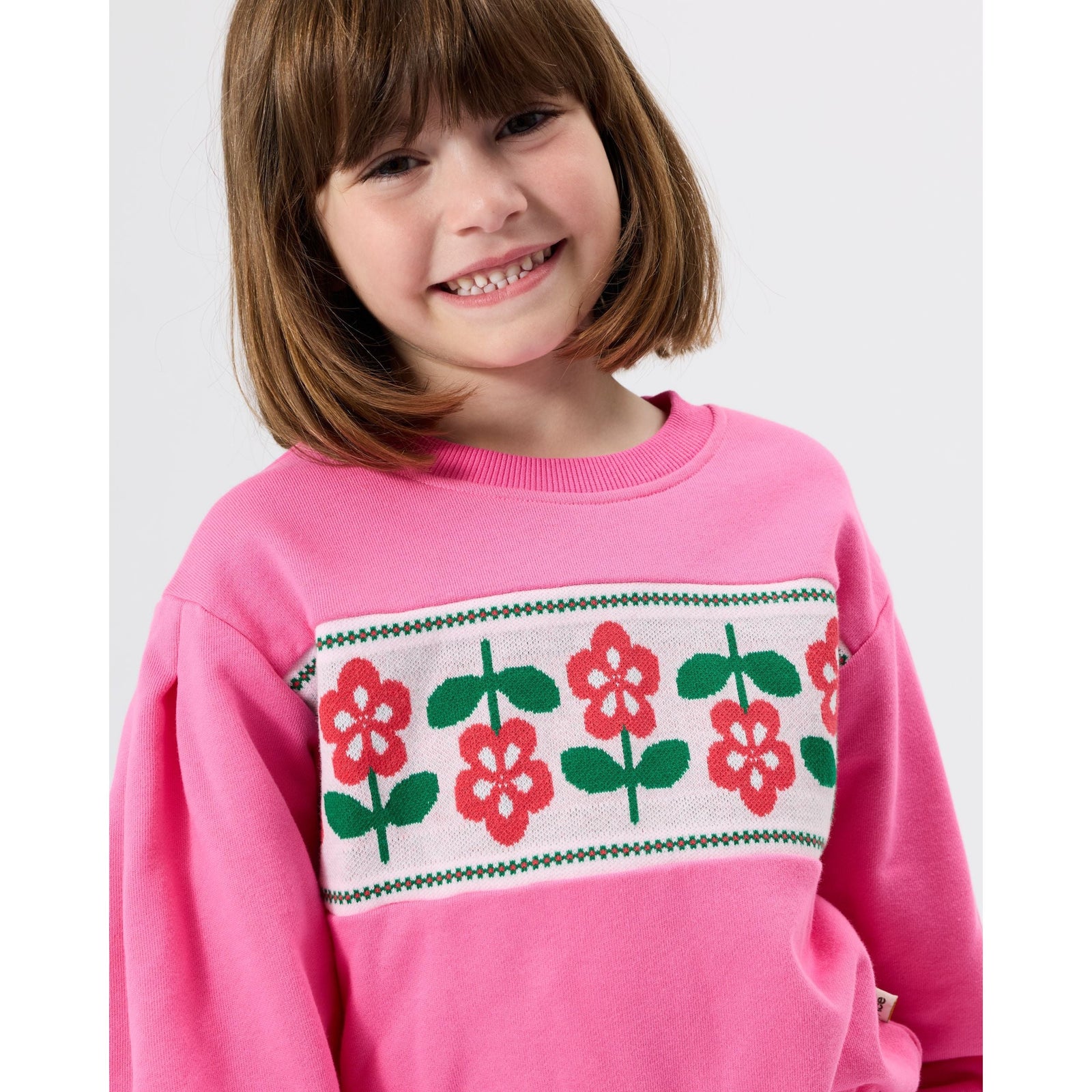 Child wearing Goldie & Ace Flower Garden Sweater