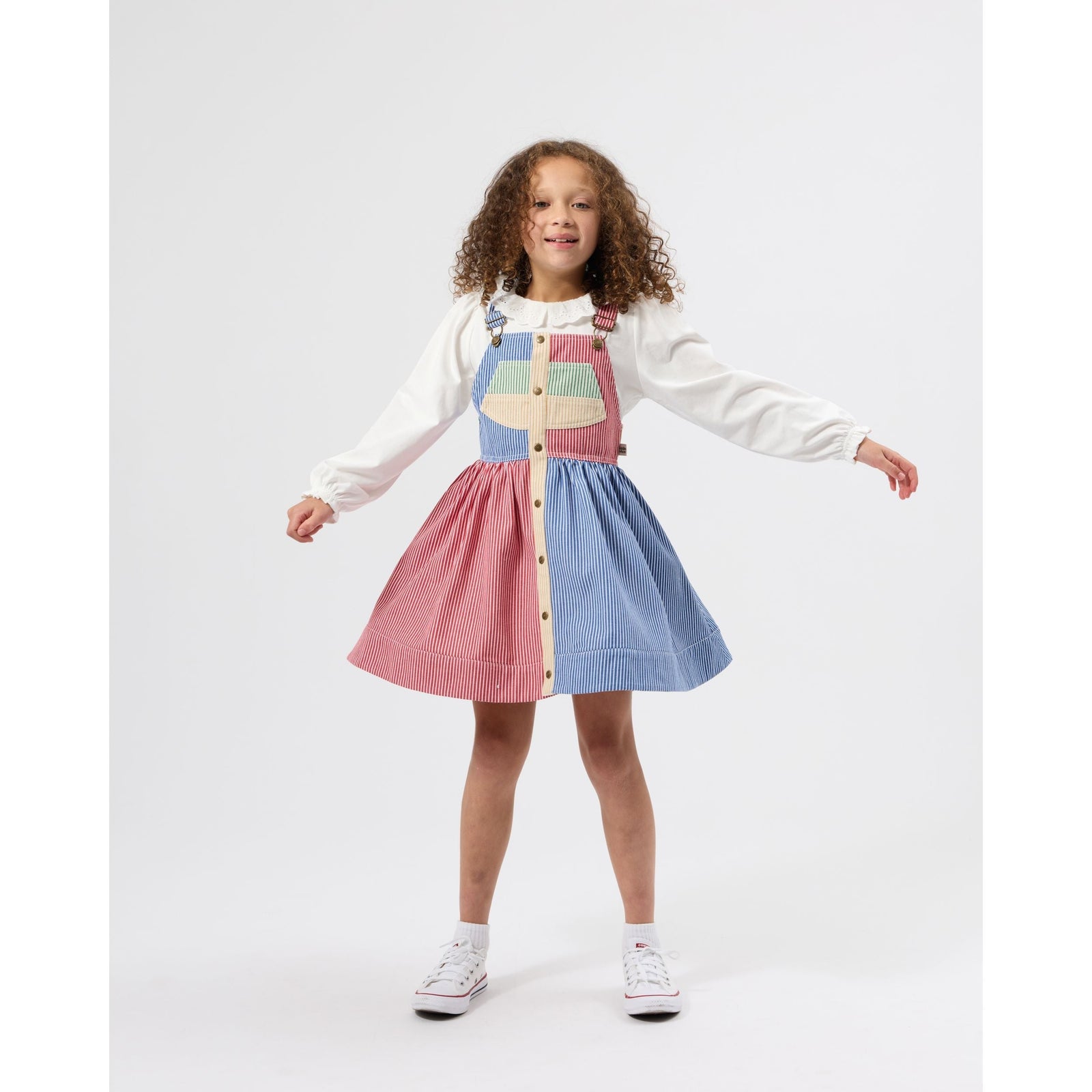 Child wearing Goldie & Ace Patchwork Stripe Heidi Pinafore Dress