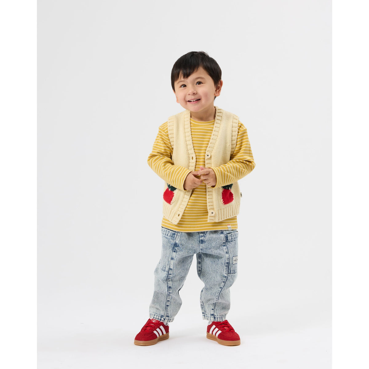 Child wearing Goldie & Ace Apple Pocket Knit Vest, view 3
