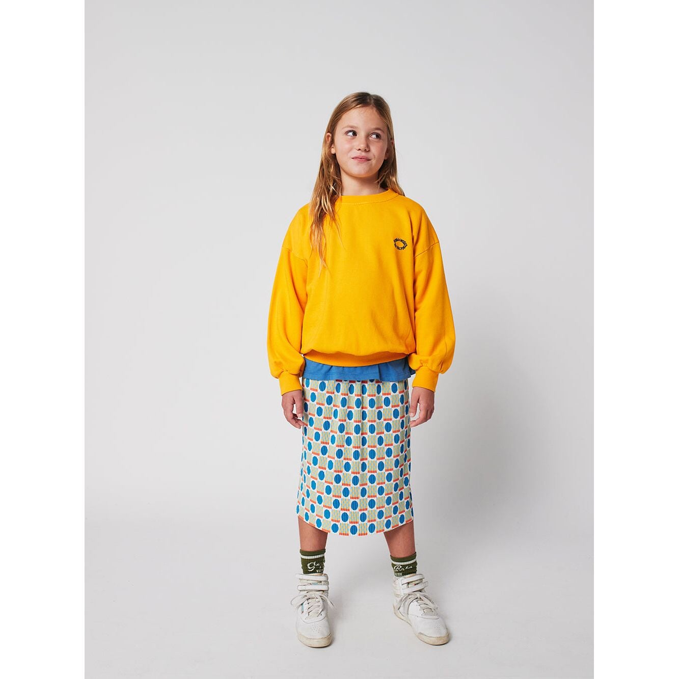 Geometric Scacs Over Pencil Pleated Skirt